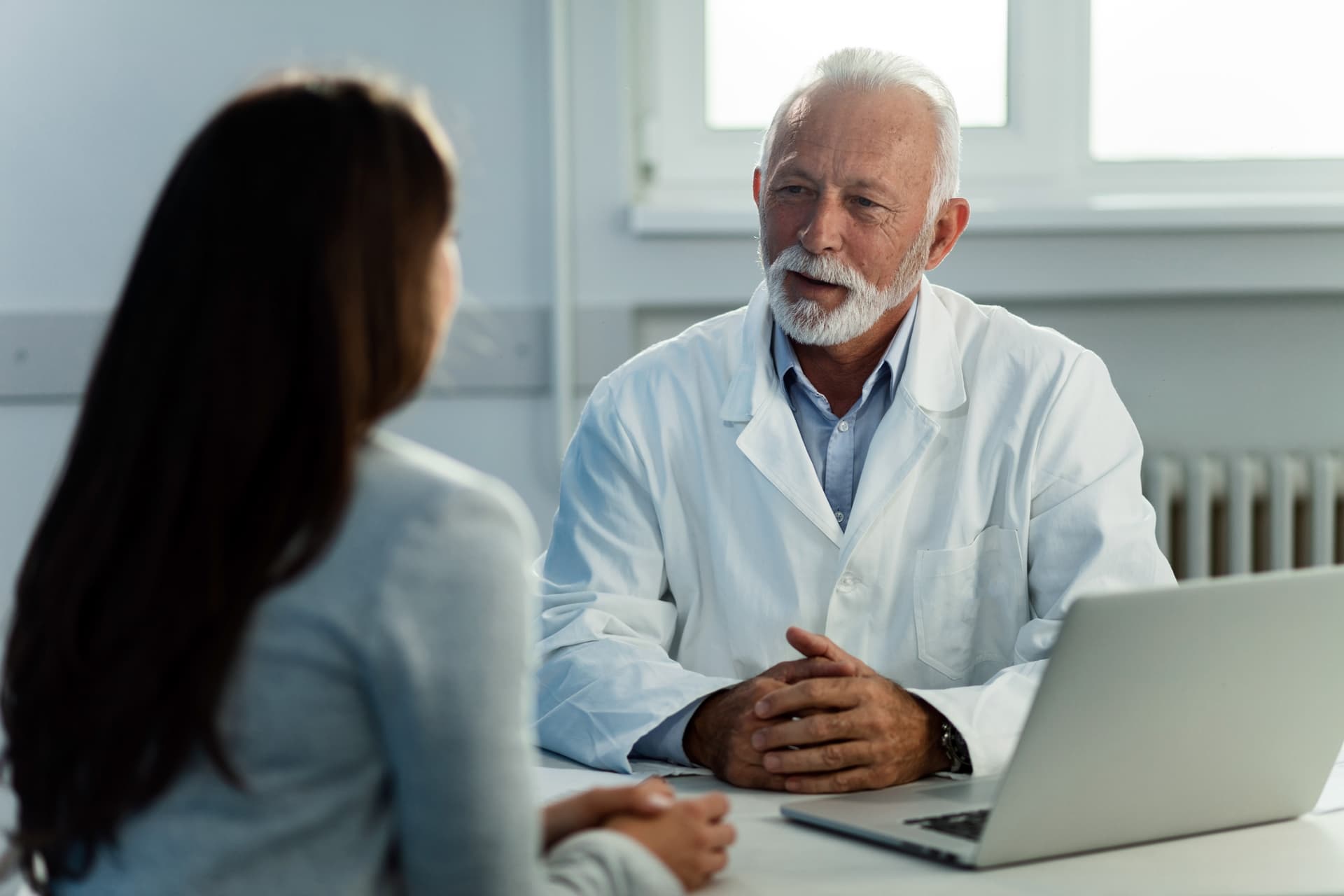 Consultant colorectal surgeon discussing haemorrhoid treatment options