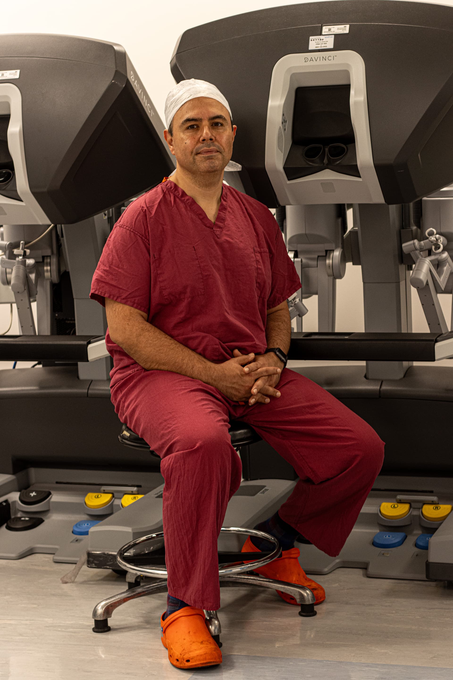 Mr Najib Daulatzai with the da Vinci robotic surgical system in theatre