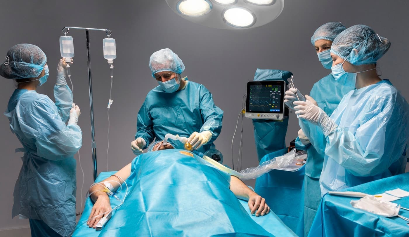 Surgeons performing a surgical procedure on a patient in the operating room
