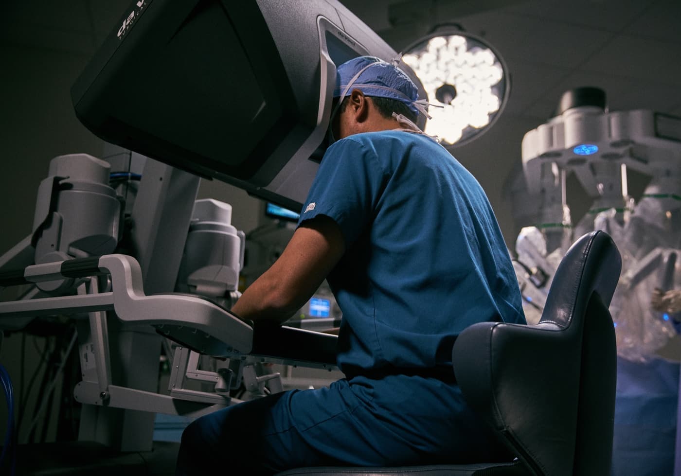 Surgeon at the da Vinci surgeon console during robotic surgery