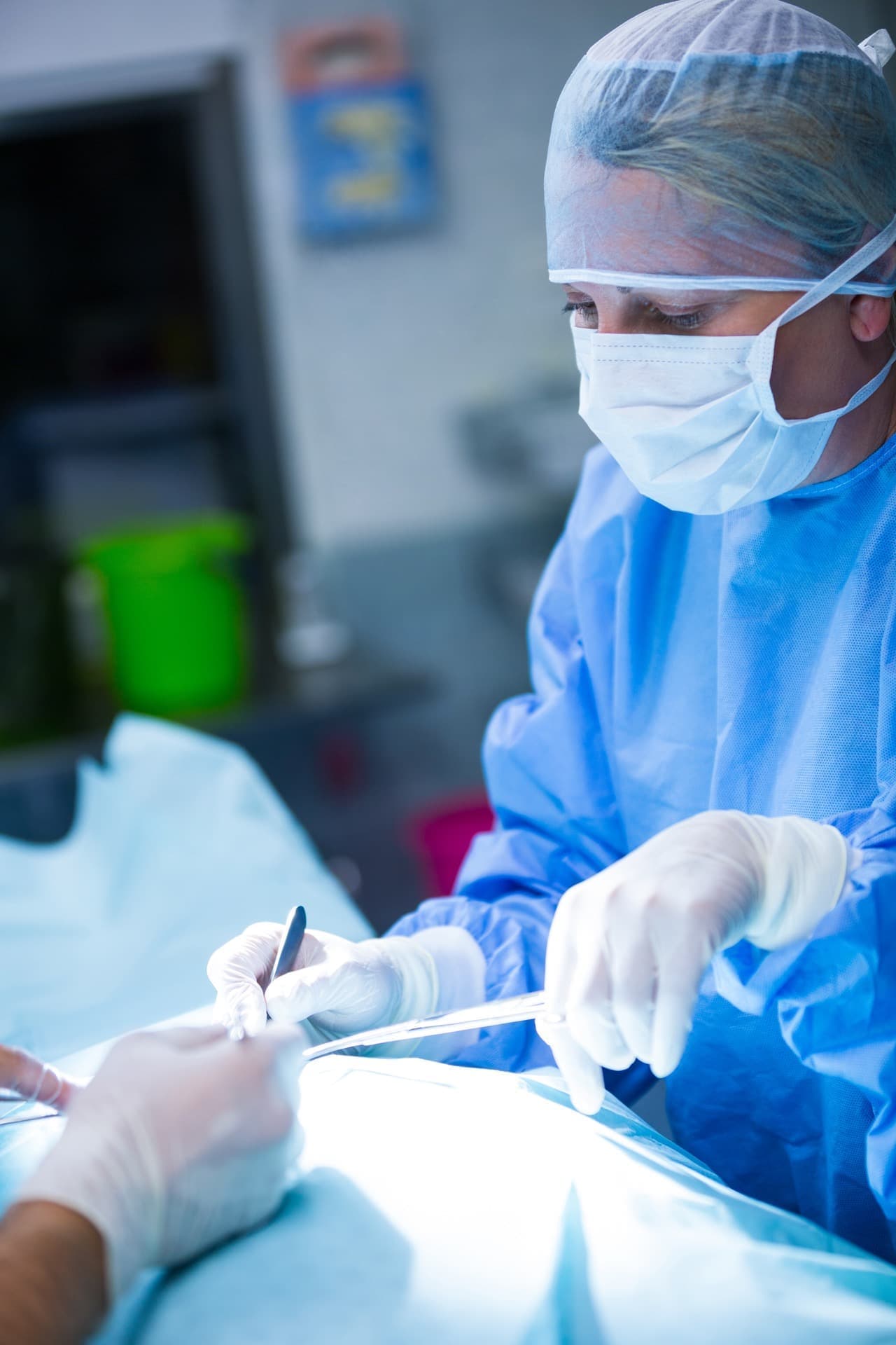 Surgeons performing minimally invasive surgery in the operating room