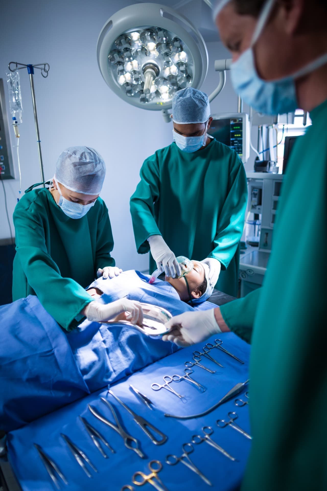 Surgeons performing colorectal surgery in a modern operating theatre